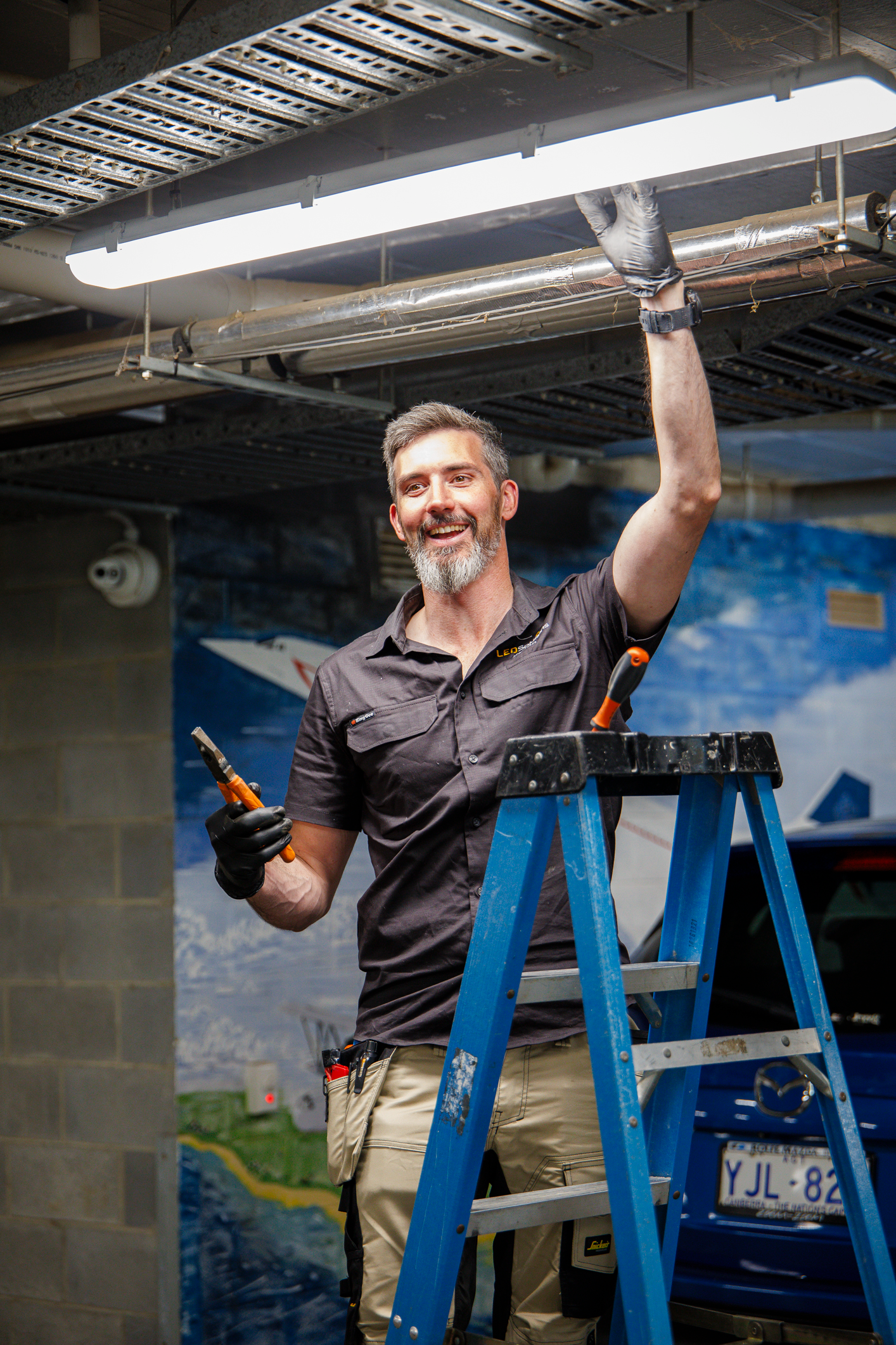 Kieran, founder of LED Solutions, installing lighting on site